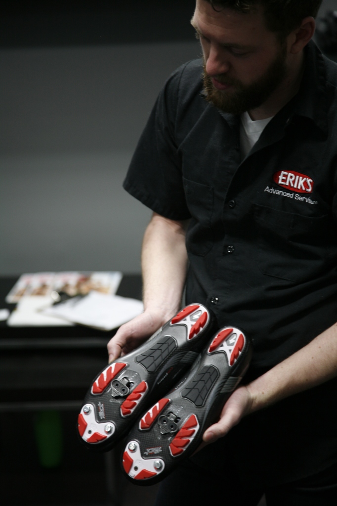 Adjusting cleats as part of a bike fitting.